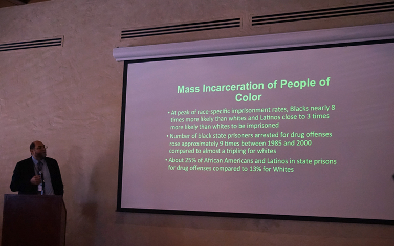 Rogelio Sáenz discusses the "big business of mass detention and incarceration of people of color" at the combined ACHTUS/BCTS meeting, June 5 in Albuquerque, New Mexico. (MT Dávila)