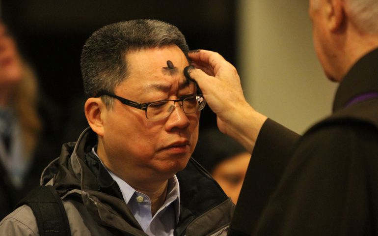 A man receives ashes on Ash Wednesday in 2014 at St. Francis of Assisi Church in New York. (CNS/Gregory A. Shemitz)