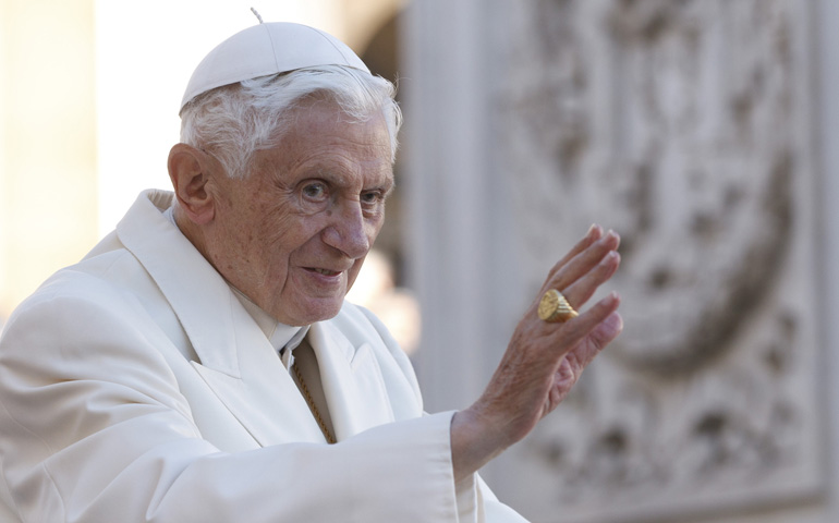 Pope Benedict XVI waves as he arrives to lead his general audience Wednesday in St. Peter's Square at the Vatican. (CNS/Paul Haring)