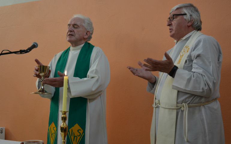 Redemptorist Fr. Tony Flannery, left, concelebrates Mass with Fr. Willie Cummins from County Clare. (NCR/Sarah Mac Donald) 