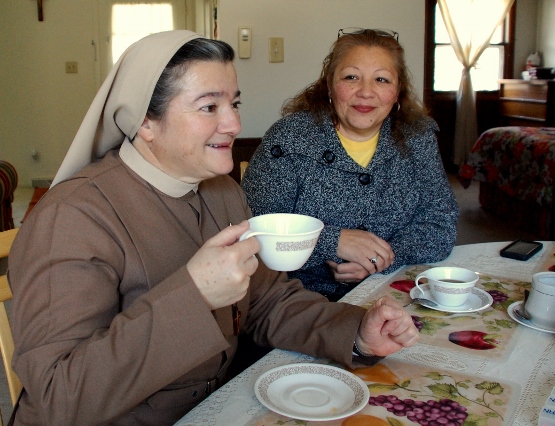 Missionary Servants of the Divine Spirit Sr. Dora Elena Orozco and local parishioner Melinda Gracia share a cup of coffee in the convent that serves the San Felipe de Jesus parish in Fennville. (GSR photo/Dan Stockman)