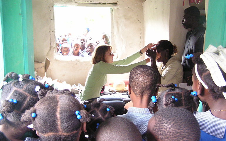 Ophthalmologist Dr. Mary Sue Carlson, parishioner of Our Lady Queen of Peace in Arlington, Va., conducts an eye exam during a mission to Medor, Haiti. (Courtesy of Mary Sue Carlson)