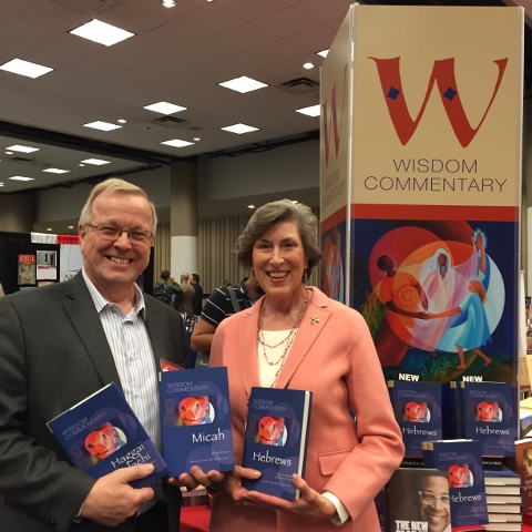 Hans Christoffersen, publisher of academic and trade markets at Liturgical Press, and Dominican Sr. Barbara Reid, coordinator of the project, pose with the first books in the Wisdom Commentary series. (Provided photo)