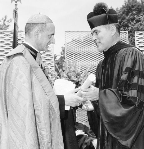 Archbishop Giovanni Battista Montini of Milan, the future Pope Paul VI, and Holy Cross Fr. Theodore Hesburgh shake hands in South Bend, Ind., in 1960. (CNS)
