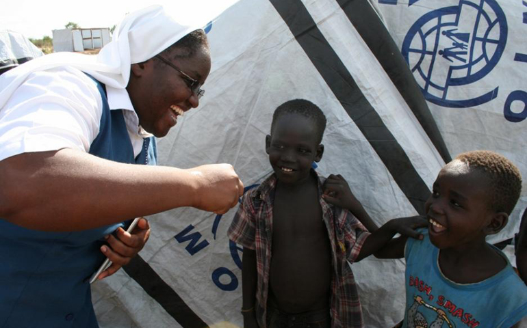 Sr. Anne Kiragu talks to children living in a camp in South Sudan. (Chris Herlinger)