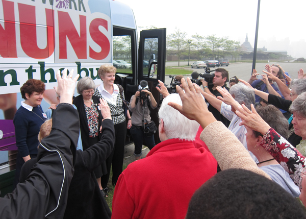 Supporters pray during the Nuns on the Bus kickoff rally Wednesday at Liberty State Park in Jersey City, N.J. (RNS/David Gibson)