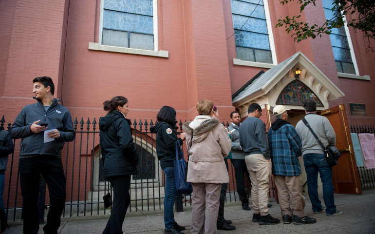 Voters wait for polling to begin Nov. 8 outside Annunciation Church in Philadelphia. (CNS/Tracie Van Auken, EPA)
