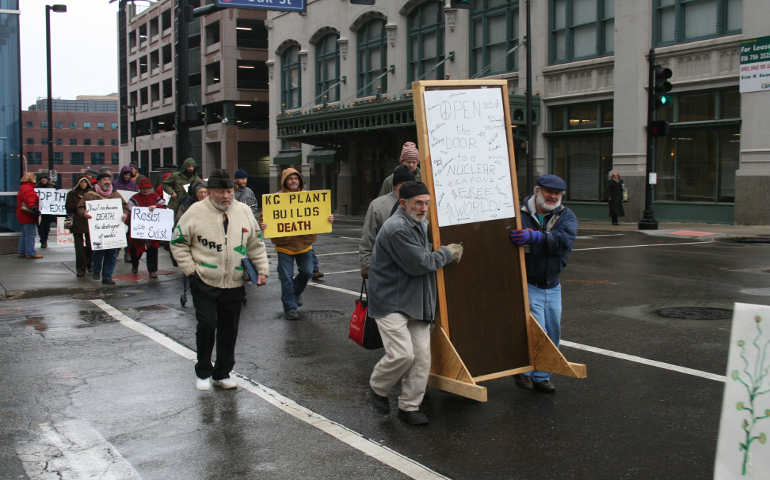 Local activists march to the Kansas City Municipal Courthouse Dec. 13 with a door that was entered into evidence. (Photos courtesy of Jim Hannah)