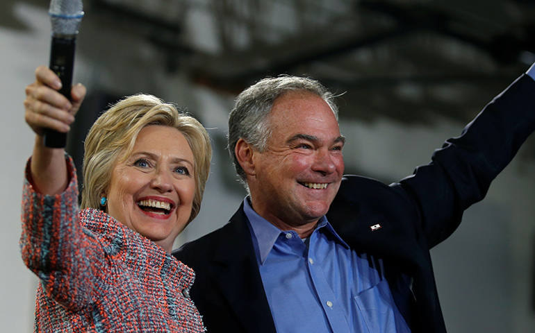 Democratic presidential candidate Hillary Clinton and U.S. Sen. Tim Kaine, D-Va., wave to the crowd during a campaign rally at Ernst Community Cultural Center in Annandale, Va., on July 14, 2016. (Courtesy of REUTERS/Carlos Barria)