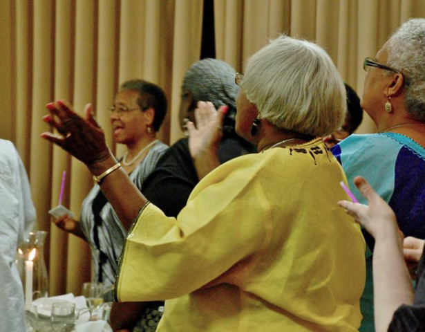 Participants clap and sing at the close of the joint meeting between the National Black Sisters Conference and three black clergy groups Wednesday in Charleston, S.C. (GSR photo/Dan Stockman) 