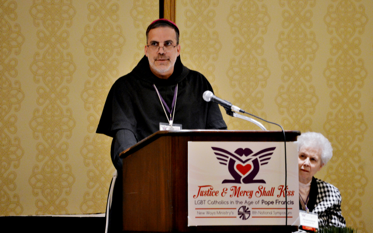 Bishop John Stowe of Lexington, Kentucky, at the New Ways Ministry symposium in Chicago April 28. Loretto Sr. Jeannine Gramick, co-founder of the organization, is seated behind him. (Robert Shine)