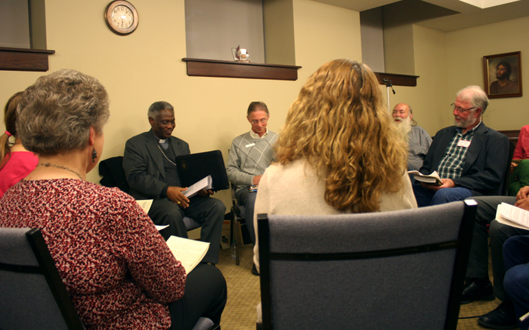 Cardinal Peter Turkson meets with members of Occupy the World Food Prize on Wednesday at First United Methodist Church in Des Moines, Iowa. (NCR photo/Megan Fincher)