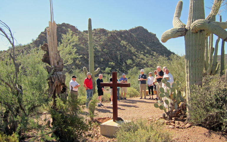The group gathers to bury the ashes of Richard Koeppen, at the Redemptorist Renewal Center in Tuscon, Arizona. (Peter Tran)