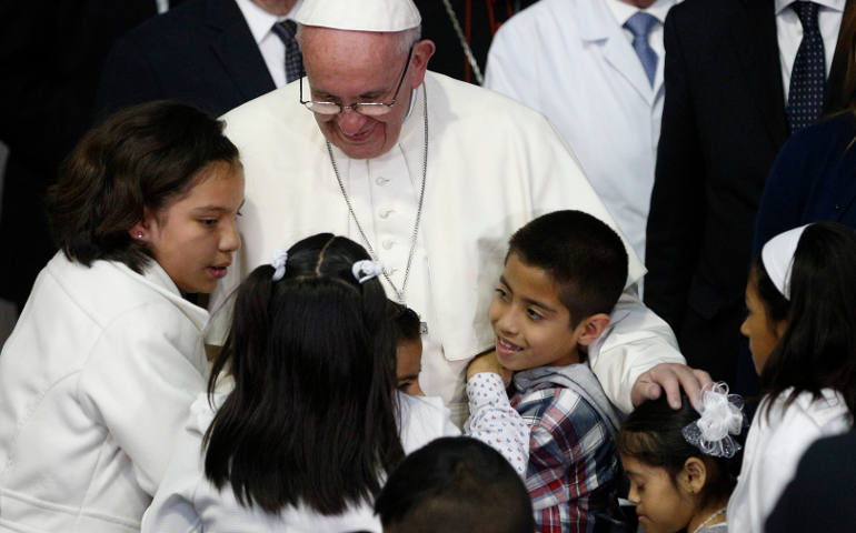 Pope Francis embraces children at Federico Gomez Children's Hospital of Mexico in Mexico City Feb. 14. (CNS/Paul Haring)