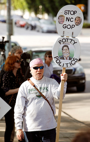 A protester takes part in a demonstration outside the state Legislature in Raleigh, N.C., on May 16, 2016. He carries a toilet seat mocking Republican politicians who approved the state’s so-called bathroom law. (Reuters/Jonathan Drake)