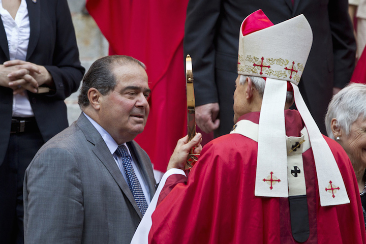 Supreme Court Justice Antonin Scalia, left, talks with Cardinal Donald Wuerl, the archbishop of Washington, at the conclusion of the annual Red Mass held at the Cathedral of St. Matthew the Apostle in Washington, Sept. 30, 2012. (Reuters/Benjamin Myers)
