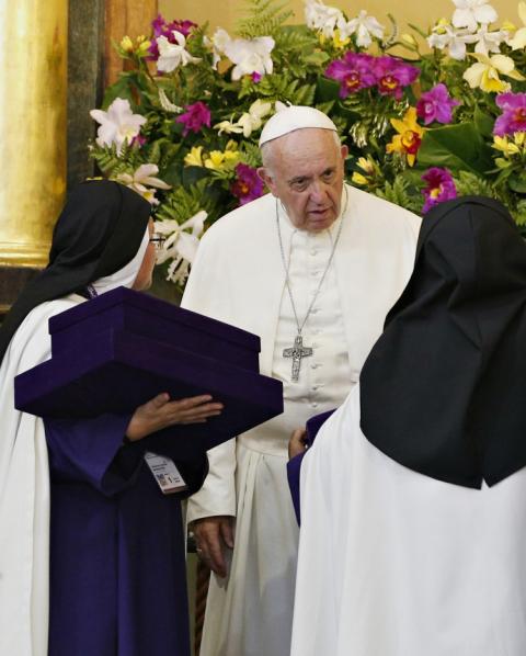 Pope Francis greets nuns as he attends mid-morning prayer with contemplative women religious at the Shrine of Las Nazarenas in Lima, Peru, Jan. 21. (CNS/Paul Haring)