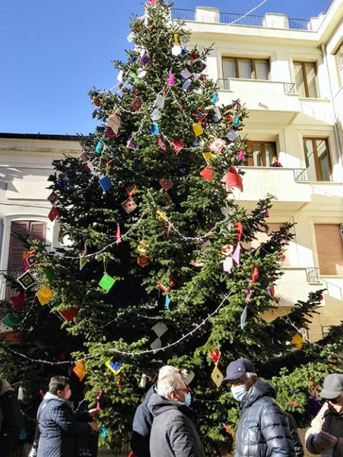 The municipal Christmas tree in the main plaza of Guardiagrele, Italy, is decorated with ornaments in the shape of diamonds and squares crocheted by women in the town. (Judith Valente)