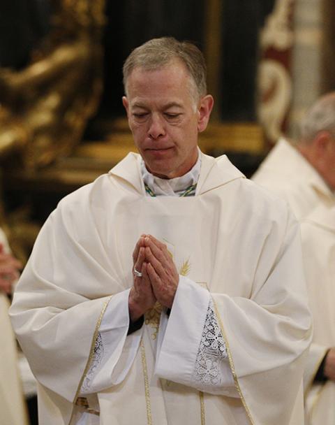 Archbishop Alexander Sample of Portland, Oregon, returns to his seat after receiving Communion during Mass at the Basilica of St. John Lateran in Rome Feb. 4, 2020. (CNS/Paul Haring)