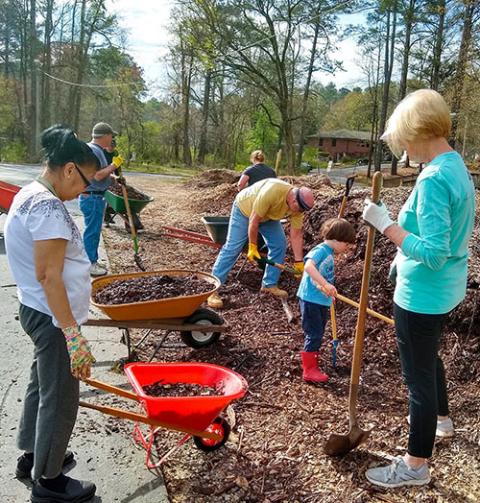 Parishioners of St. John Neumann Church in Lilburn, Georgia, work on the parish garden in 2020. The parish has saved $9,000 per year on energy costs by going green. (CNS/Courtesy of St. John Neumann Church)