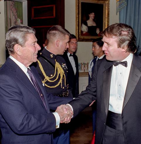 President Ronald Reagan shakes hands with Donald Trump at a reception for the Friends of Art and Preservation in Embassies Foundation, at the White House on Nov. 3, 1987. (Wikimedia Commons/U.S. National Archives and Records Administration)