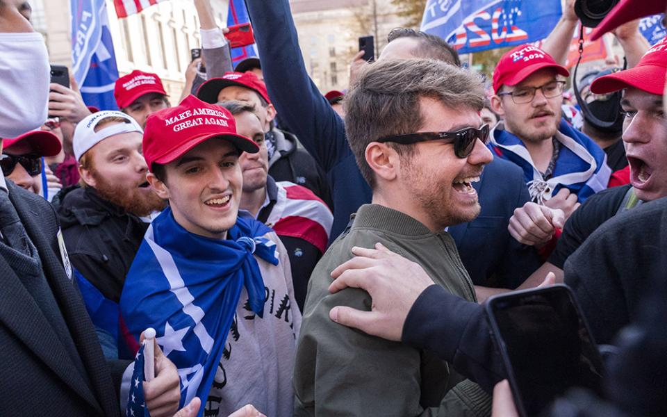 Nick Fuentes right-wing podcaster, center right in sunglasses, greets supporters before speaking at a pro-Trump march, Nov. 14, 2020, in Washington. Former President Donald Trump had dinner Nov. 22 at his Mar-a-Lago club with the rapper formerly known as Kanye West, who is now known as Ye, as well as Nick Fuentes, who has used his online platform to spew antisemitic and white supremacist rhetoric. (AP photo/Jacquelyn Martin, file)