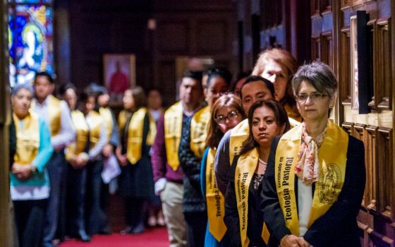 Lay students receiving a pastoral theology certificate in Spanish line up before Mass and a graduation ceremony in January 2016 at Holy Spirit Church in Atlanta. (CNS/Georgia Bulletin/Thomas Spink)