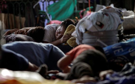 Asylum-seeking migrants sleep in a public square in Reynosa, Mexico, where hundreds of migrants live in tents, on June 9. (CNS/Reuters/Daniel Becerril)