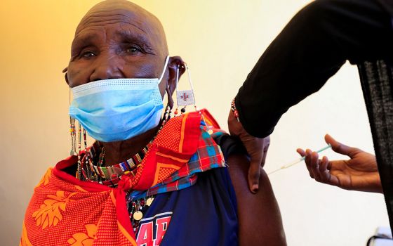 A member of the Indigenous Maasai community receives the COVID-19 vaccine at a health center near Nairobi, Kenya, Aug. 23. (CNS/Reuters/Thomas Mukoya)