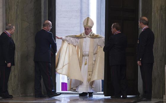 Pope Francis opens the Holy Door of St. Peter's Basilica to inaugurate the Jubilee Year of Mercy at the Vatican in this Dec. 8, 2015, file photo. (CNS/Vatican Media)