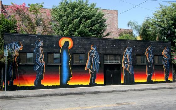 In 1990, Gary Palmatier painted the “Jesus of the Bread Line” mural, an interpretation of an etching by Fritz Eichenberg, on a wall of the Catholic Worker soup kitchen in Los Angeles. (Mike Wisniewski)