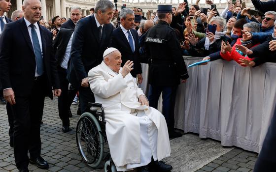 Pope Francis greets visitors after his weekly general audience in St. Peter's Square at the Vatican March 6, 2024. (CNS/Lola Gomez)