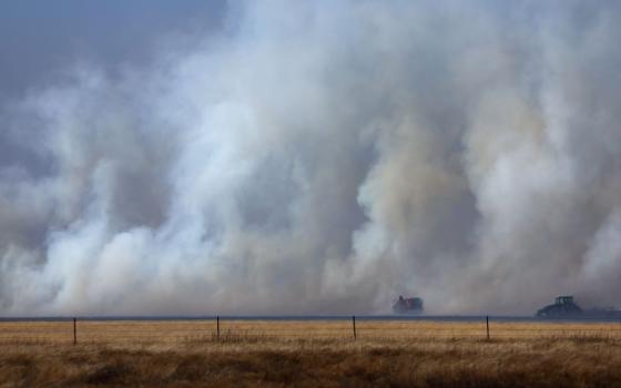 Local firefighters work to contain a wildfire after it was whipped up by high winds in Pampa, Texas on March 2. (OSV News/Reuters/Leah Millis)