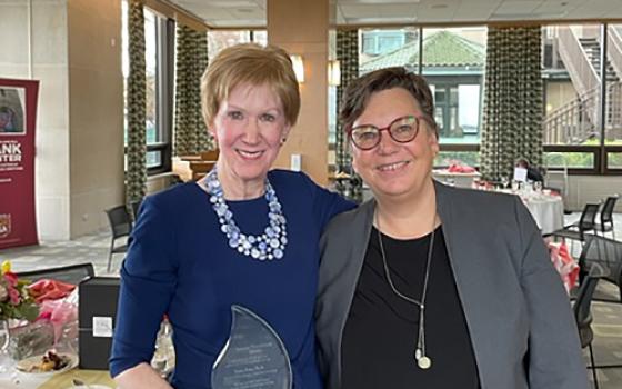 Susan Ross (left), with Hille Haker, holds Loyola University Chicago's Living Tradition Award. (Courtesy of Hank Center for the Catholic Intellectual Heritage)