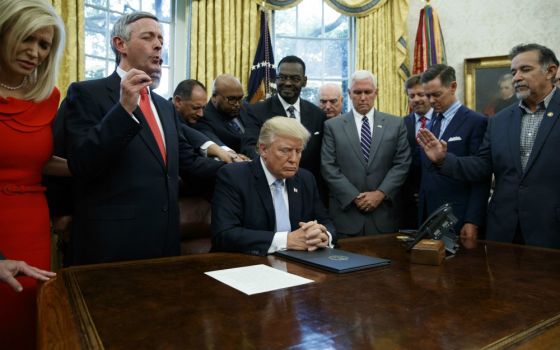 On Sept. 1, 2017, religious leaders pray with President Donald Trump in the Oval Office of the White House in Washington after he signed a proclamation for a National Day of Prayer to occur on Sunday, Sept. 3, 2017. (AP Photo/Evan Vucci)