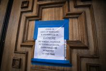 A sign on the door of St. Mary's Catholic Church in Landover Hills, Maryland, alerts the public there will be no Mass. (CNS/Chaz Muth)