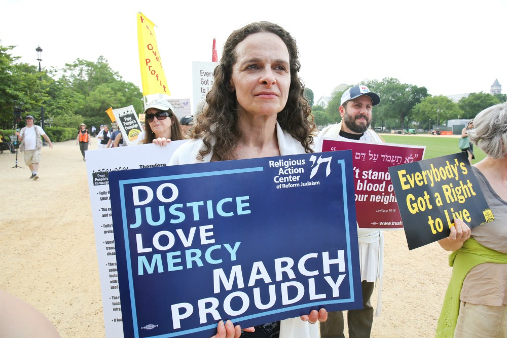Rabbi Jennie Rosenn, founder and CEO of Dayenu: A Jewish Call to Climate Action, takes part in a demonstration on the National Mall in Washington, D.C. (Courtesy of the Religious Action Center of Reform Judaism)