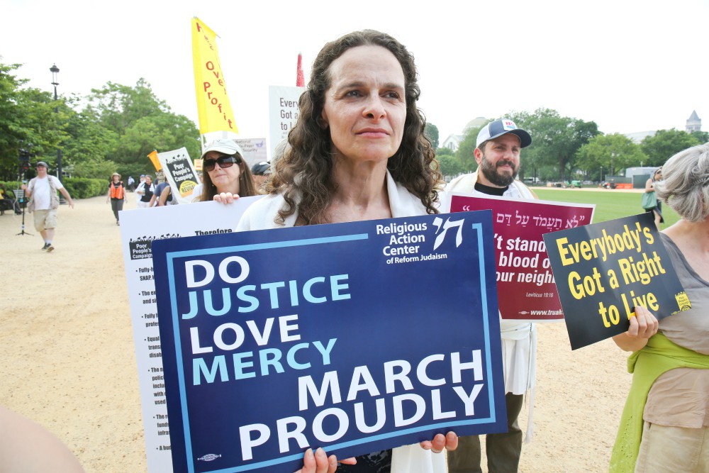 Rabbi Jennie Rosenn, founder and CEO of Dayenu: A Jewish Call to Climate Action, takes part in a demonstration on the National Mall in Washington, D.C. (Courtesy of the Religious Action Center of Reform Judaism) Rabbi Jennie Rosenn, founder and CEO of Dayenu: A Jewish Call to Climate Action, takes part in a demonstration on the National Mall in Washington, D.C. (Courtesy of the Religious Action Center of Reform Judaism)