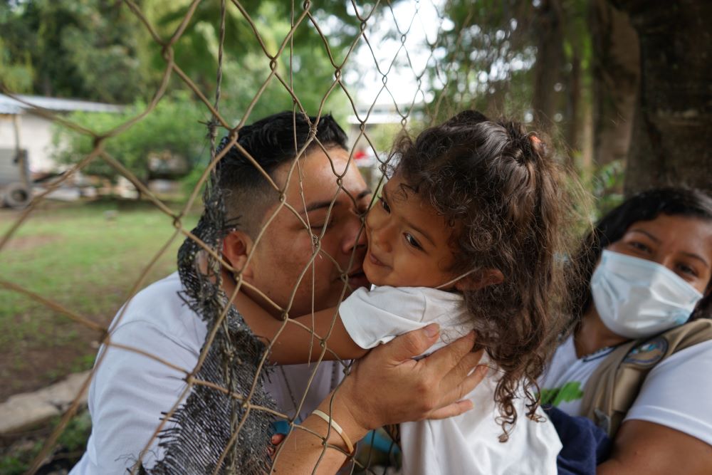 : One of the Guapinol 8 greets his daughters for the first time in nearly a year. (SHARE Foundation/Mark Coplan)