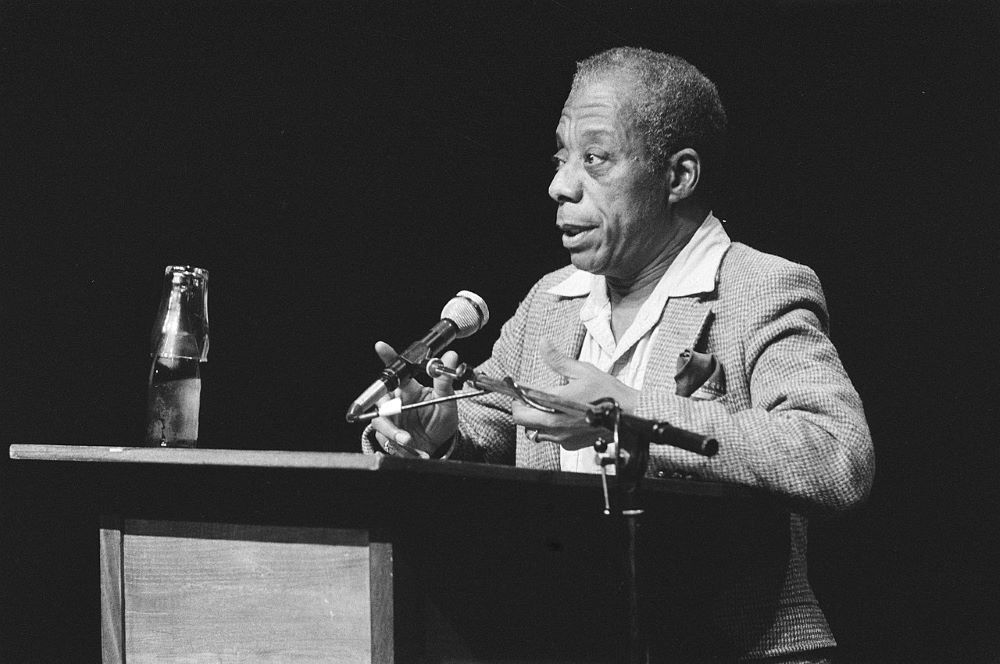 The influential novelist and essayist James Baldwin (1924-1987) speaks in Amsterdam in 1984. Giovanni's Room was published in 1956. (Wikimedia Commons/Fotocollectie Anefo Reportage)
