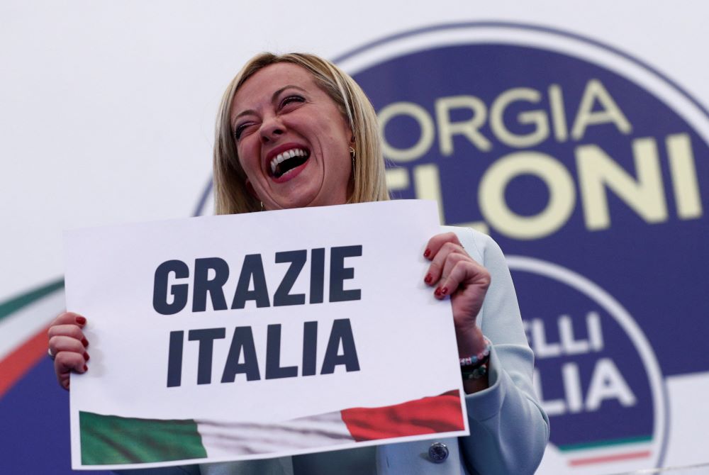 Giorgia Meloni, leader of Brothers of Italy, holds a sign at the party's election night headquarters in Rome Sept. 26. Italian voters handed a victory to a coalition of center-right parties and set the stage for Meloni to become the next prime minister. 