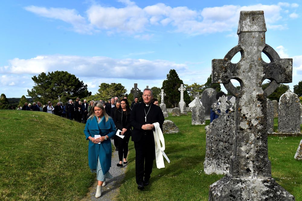 Archbishop Eamon Martin of Armagh, Northern Ireland, leads delegates on a prayer walk at a pre-synodal assembly in the sixth-century monastic site of Clonmacnoise in Ireland June 18, 2022. (CNS/Reuters/Clodagh Kilcoyne)