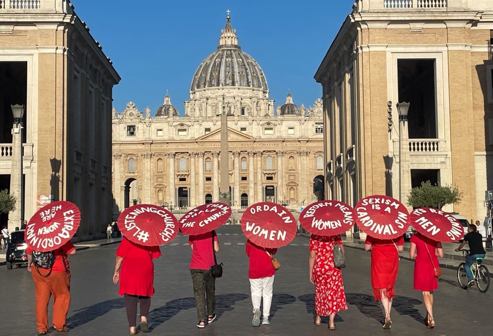 Women's ordination advocates walk toward St. Peter's Square as part of a witness on Aug. 29. The author notes that women's issues in the church is showing up in national synod syntheses from all over the world.