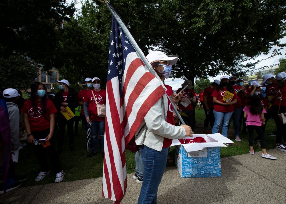 Migrant families and immigration advocates in Washington call for a pathway toward U.S. citizenship as they gather near Benjamin Banneker Park to march toward the U.S. Immigration and Customs Enforcement building Sept. 21. (CNS/Tyler Orsburn)