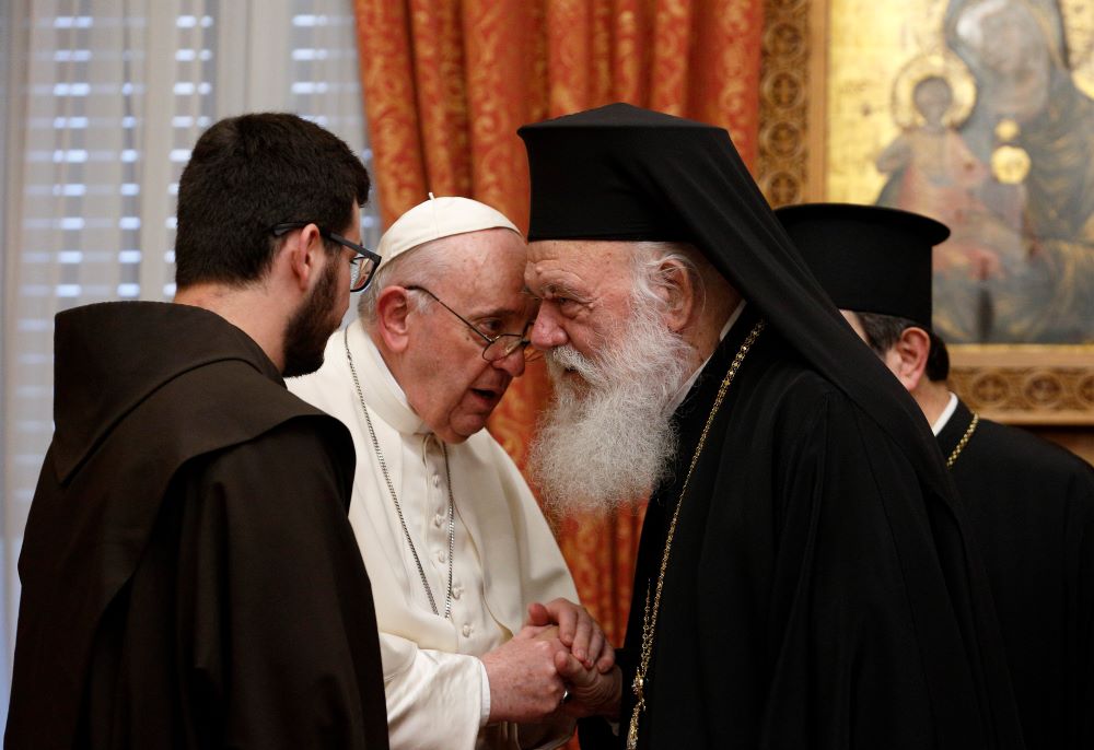 Pope Francis talks with Orthodox Archbishop Ieronymos II of Athens and all Greece during a meeting with their delegations in the Throne Room of the archbishopric in Athens, Greece, Dec. 4, 2021. (CNS photo/Paul Haring)