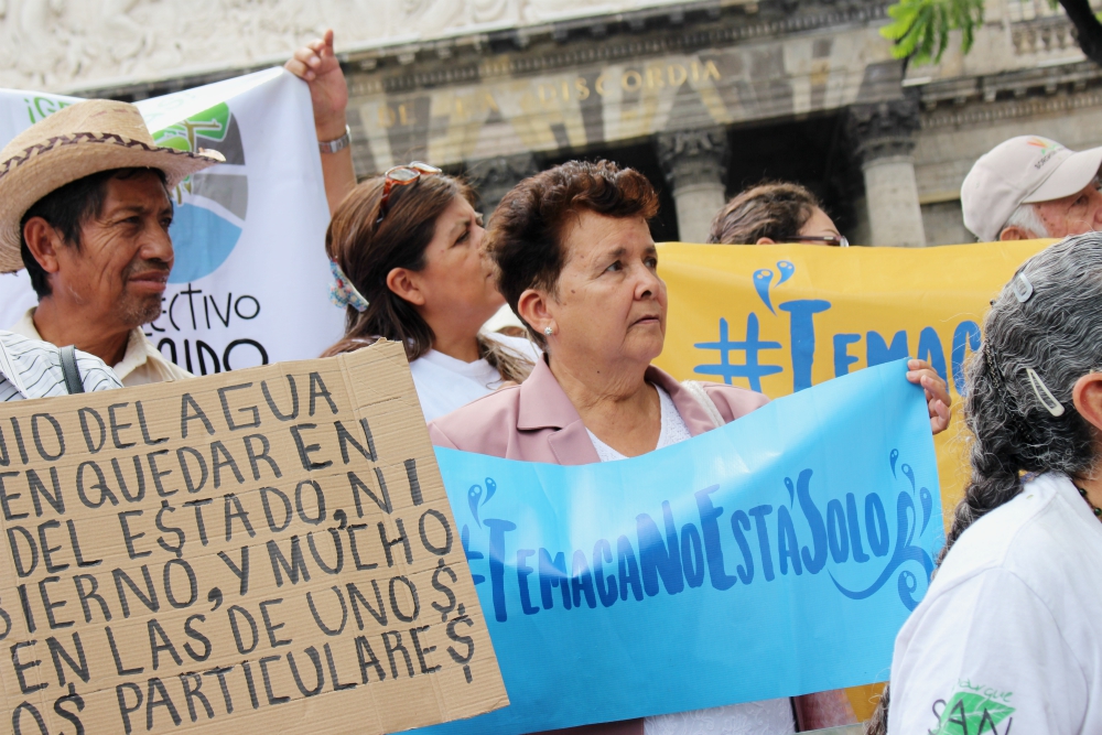 "Temaca, You Are Not Alone": Guadalupe Lara holds up a sign in defense of Temacapulín, another Jalisco village threatened by a dam, at July 2019 press conference in Guadalajara by the Mexican Institute for Community Development. (Tracy L. Barnett) "Temaca, You Are Not Alone": Guadalupe Lara holds up a sign in defense of Temacapulín, another Jalisco village threatened by a dam, at July 2019 press conference in Guadalajara by the Mexican Institute for Community Development. (Tracy L. Barnett)