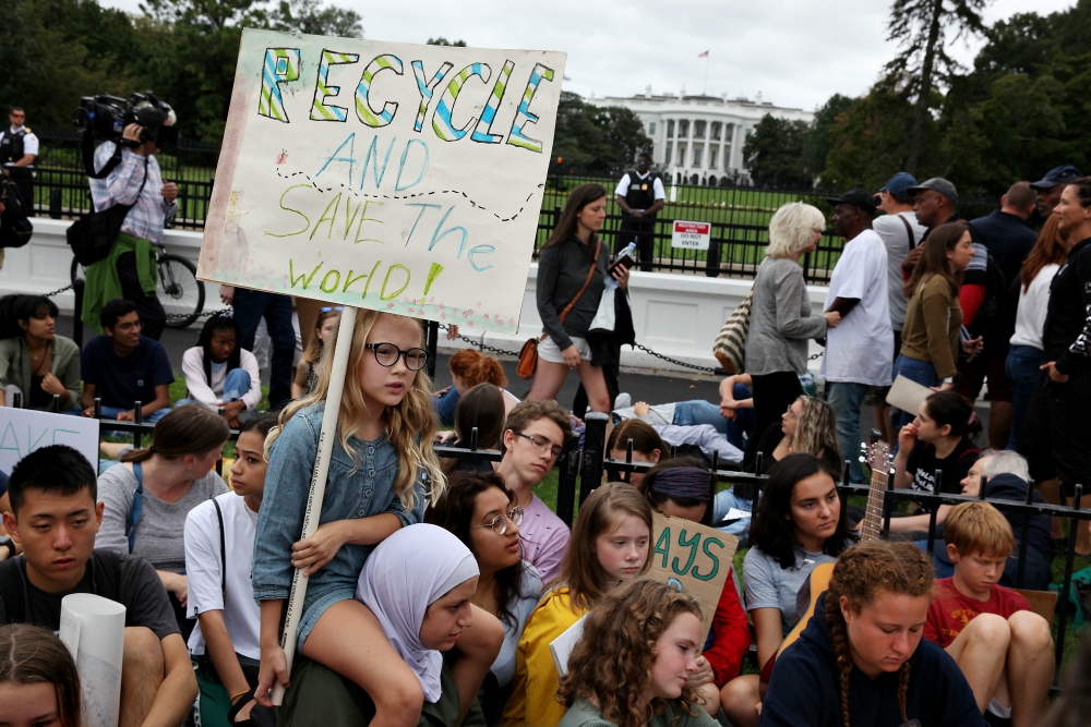Hundreds of students and young people and their supporters rally on the Ellipse behind the White House Sept. 13 in a Friday student climate strike protest. (Rick Reinhard)