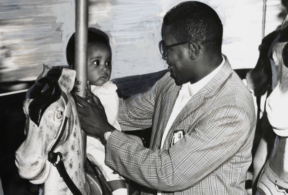 The Baltimore Sun photo of 11-month-old Sharon Langley and her father on the carousel at Gwynn Oak Amusement Park on Aug. 28, 1963, in Baltimore. (©Hearst Communications, Inc.) The Baltimore Sun photo of 11-month-old Sharon Langley and her father on the carousel at Gwynn Oak Amusement Park on Aug. 28, 1963, in Baltimore. (©Hearst Communications, Inc.)