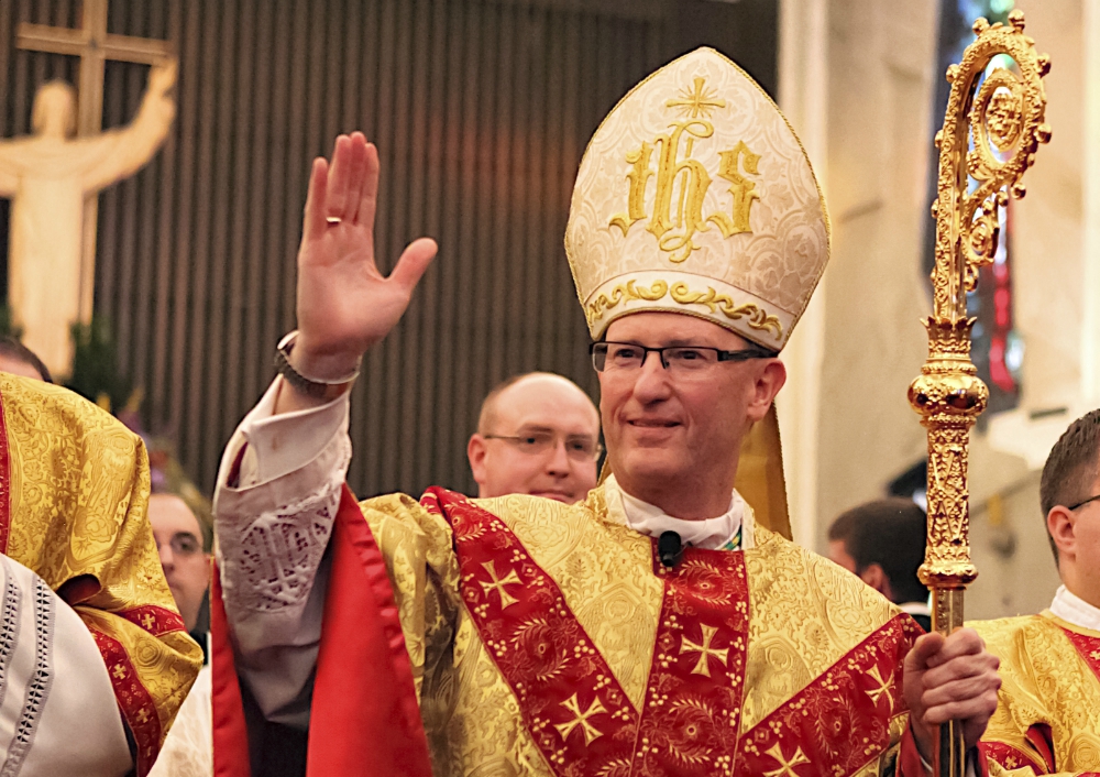 Bishop James Conley blesses the faithful Nov. 20, 2012, as he leaves the Cathedral of the Risen Christ in Lincoln, Nebraska, after his installation as bishop of Lincoln. (CNS/Southern Nebraska Register/Courtesy of Kevin Clark)