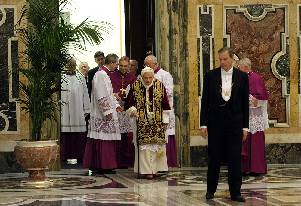 Pope Benedict XVI walks with a cane as he arrives for a meeting of cardinals at which he read his resignation in this Feb. 11, 2013, file photo from the Vatican. There were no media members in attendance. (CNS/L'Osservatore Romano) Pope Benedict XVI walks with a cane as he arrives for a meeting of cardinals at which he read his resignation in this Feb. 11, 2013, file photo from the Vatican. There were no media members in attendance. (CNS/L'Osservatore Romano)